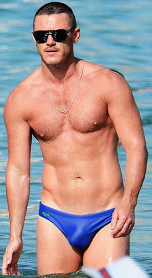 famousmeat:  Luke Evans’ speedo bulge at the beach with male companion in Mykonos 