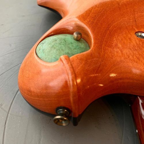 M-tone guitar detail. Copper access dome in carved mahogany back. #mtoneguitars #handmadeguitars #ha