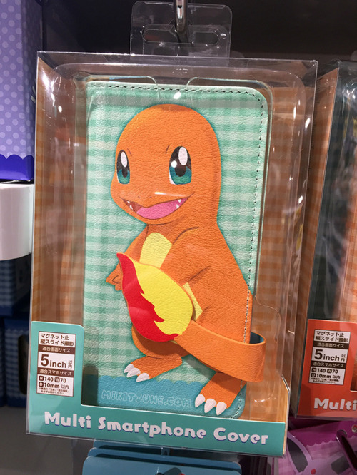 Flip phone cases featuring Charmander, Mimikyu, Sylveon, and Pikachu from the Pokemon Center Tails &