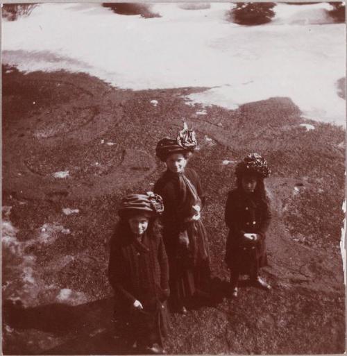 Grand Duchesses Marie, Anastasia and Olga Nikolaevna Romanov looking up at the camera.