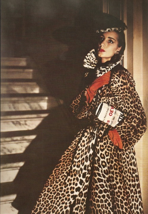 Elizabeth &ldquo;Betty&rdquo; Threatt holding a newspaper while wearing a fur coat by Traina