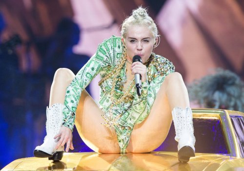 pornwhoresandcelebsluts:  Miley Cyrus spread eagle.. fingering herself and showing off her crotch to her adoring teenage fans live in concert