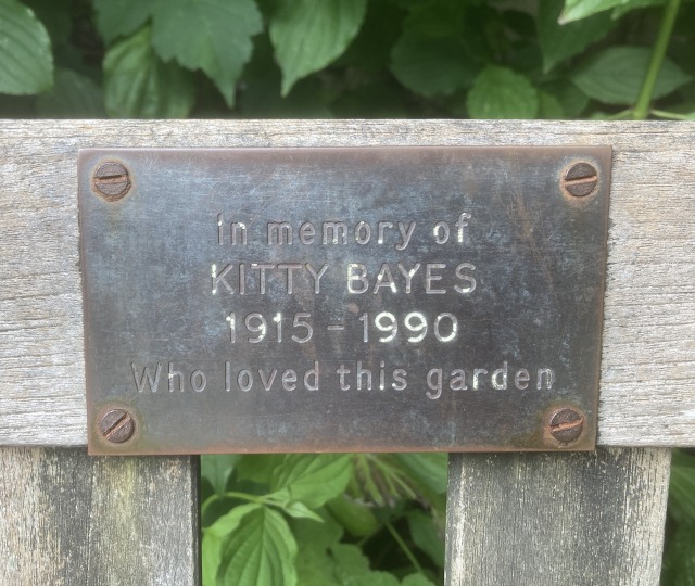A memorial bench plaque for Kitty who loved the Southover Grange gardens in Lewes, Sussex, UK