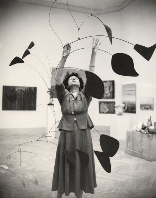 Marguerite &ldquo; Peggy &rdquo; Guggenheim with a mobile by Alexander Calder