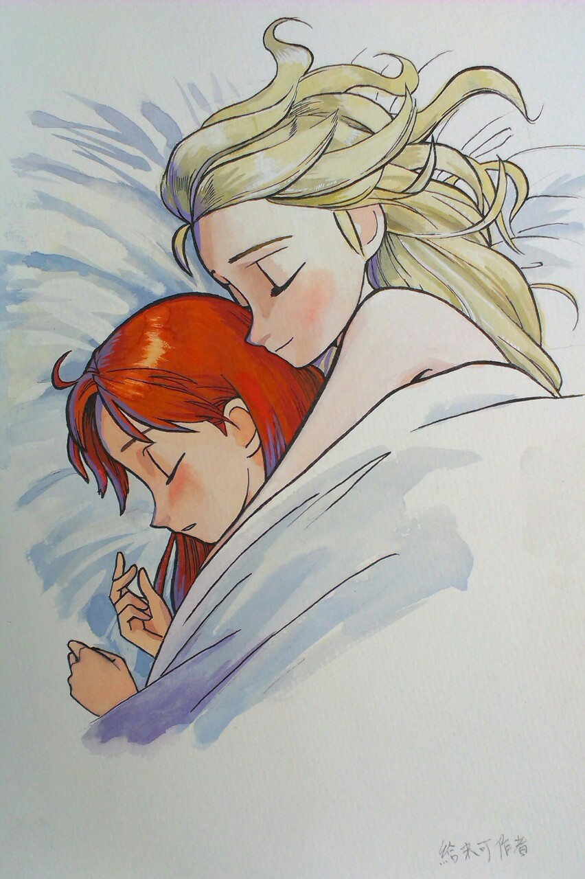 Couple sleeping under blanket