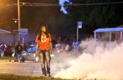 areyoutryingtodeduceme:  breakingnews:  Police fire tear gas at crowds near St. Louis amid unrest over teen’s death St. Louis Post-Dispatch: Police dressed in riot gear fired tear gas and rubber bullets into crowds in Ferguson, Mo., on Monday night