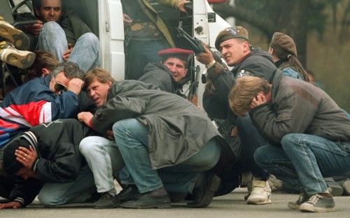 July 1995: A group of Bosnian Muslims, refugees from Srebrenica, walk to be transported from the eas