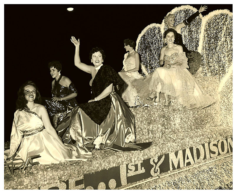 Gay Dawn waves to the crowd from the very top of a float promoting the &lsquo;RIVOLI