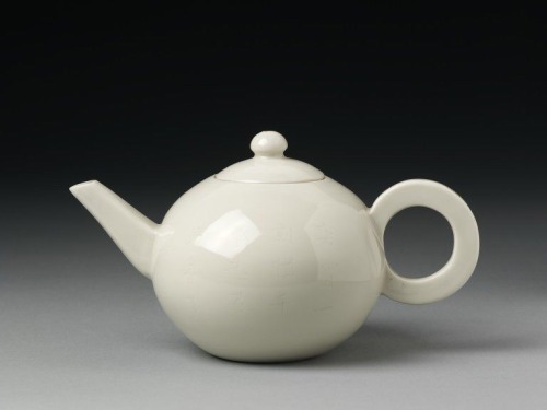 Teapot and lid, 1650-1700. White porcelain. Dehua, China.One side is subtly incised with a design of