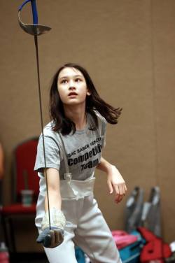 modernfencing: [ID: a fencer balancing her sabre vertically in her hand.] A fencer at the Mariel Zagunis Summer Nationals camp! Photo by Serge Timacheff. 