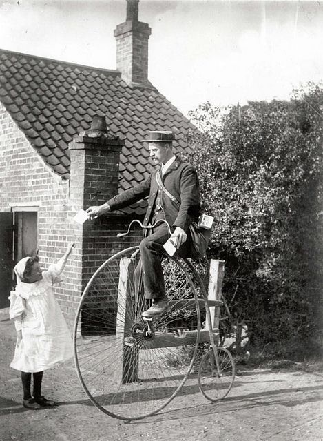 Postman on a penny farthing by British Postal Museum, ca. 1890s