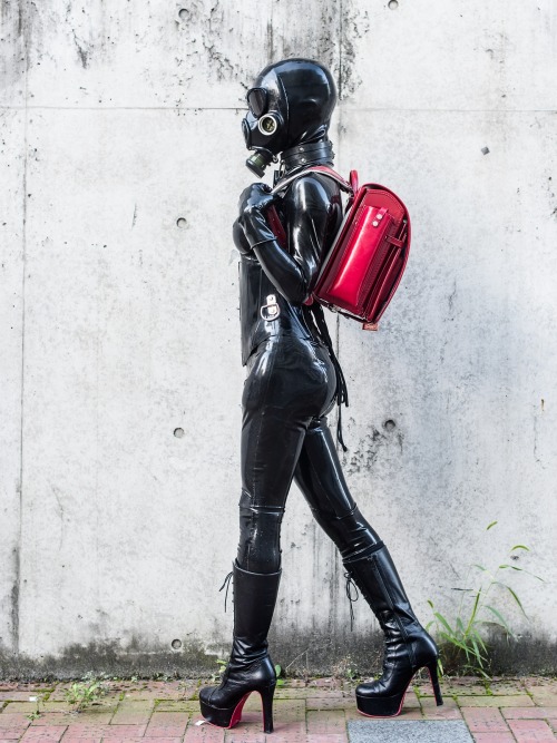 sutiblr:  Black Rubber Latex Catsuit with Red Randoseru in Public