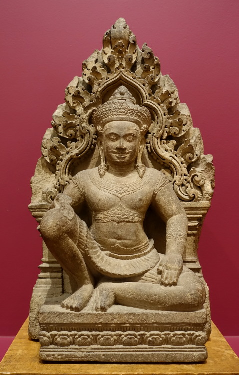Sandstone sculpture of a seated figure in a niche, in the Banteay Srei style.  Artist unknown; ca. 9