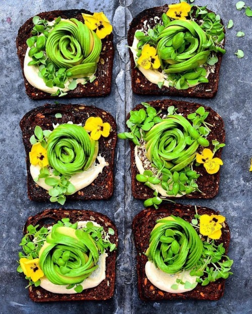 Avocado roses on tahini sauce toasts by @fooddeco #letscookvegan