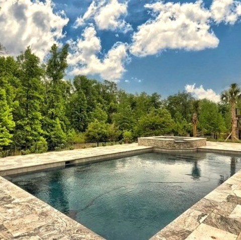 Inspiration For A Large Backyard Stone And Rectangular Lap Hot Tub RemodelInspiration For A Large Backyard