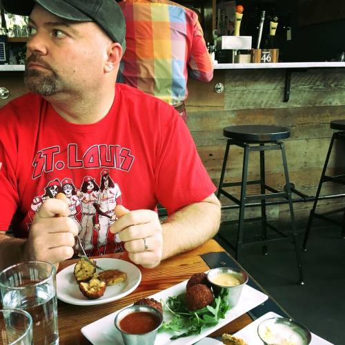 <p>A really nice date afternoon with my handsome and hilarious husband. He makes me laugh daily. I’m also super impressed that he managed to get all the things he loves onto one shirt. #gocards #kiss #guitars  (at Burger UP)</p>