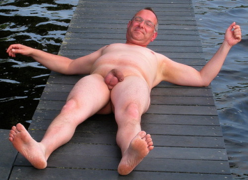 averagedudenextdoor:  Pale uncut dude who shaves his whole body, enjoying some naked time on the dock