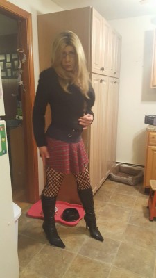 cdelizabeth:  A crazy little outfit with a body stocking, short skirt and yes…you guessed it boots!