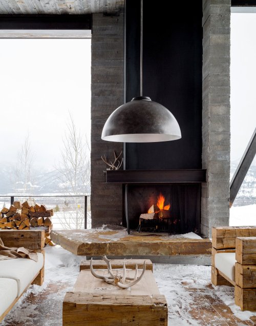 stylish-homes:  Outdoor room with fireplace and a beautiful view of the mountain range in Jackson Hole, Wyoming. Sliding barn doors can be used to enclose the space. 