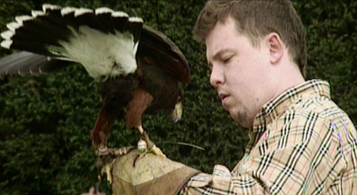 Alexander McQueen looking glamorous with a hawk in the 2018 documentary “McQueen”