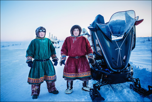 Nenets people stay as their snowmobile engine leaked and loosing antifreeze. Taz peninsula, Yamal re