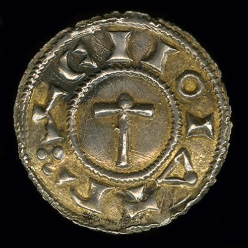 artofthedarkages:A Viking penny with an image of Thor’s hammer with a “Hand of God” resting on top o