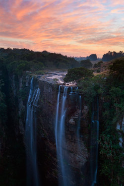 musts:  Magwa Falls by Hougaard Malan| Facebook  | 500px | Website | Blog | Prints |  A slow winter flow cascades over the edge of Magwa Falls as a colorful sunrise paints the skies over Pondoland  Wild Coast, South Africa 