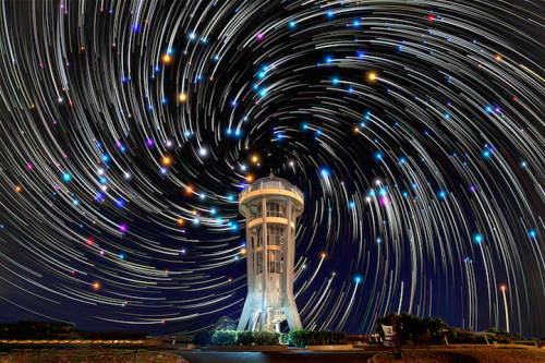 mymodernmet:  Singapore-based photographer Justin Ng captures absolutely breathtaking photos of the night sky, including these dazzling composite images of star trails curving over various landscapes. 