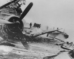 militaryhistoryphotos:  Sailors of the USS Hancock (CV-19) dousing flames after a successful Japanese Kamikaze attack. April 1, 1945.   