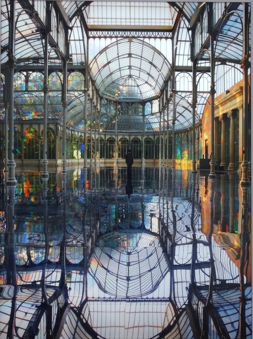 sunfl0werpetal:  cubebreaker:  Artist Kimsooja transformed the Palacio de Cristal into a heavenly dreamworld using translucent diffraction film on the windows to create a rainbow effect which reflected off the mirrored floor.  I believe in the good things