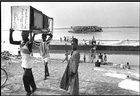 Kadir van Lohuizen: Niger - ocean to ocean (West Africa, 1996)The brown God runs from Guinee, very c