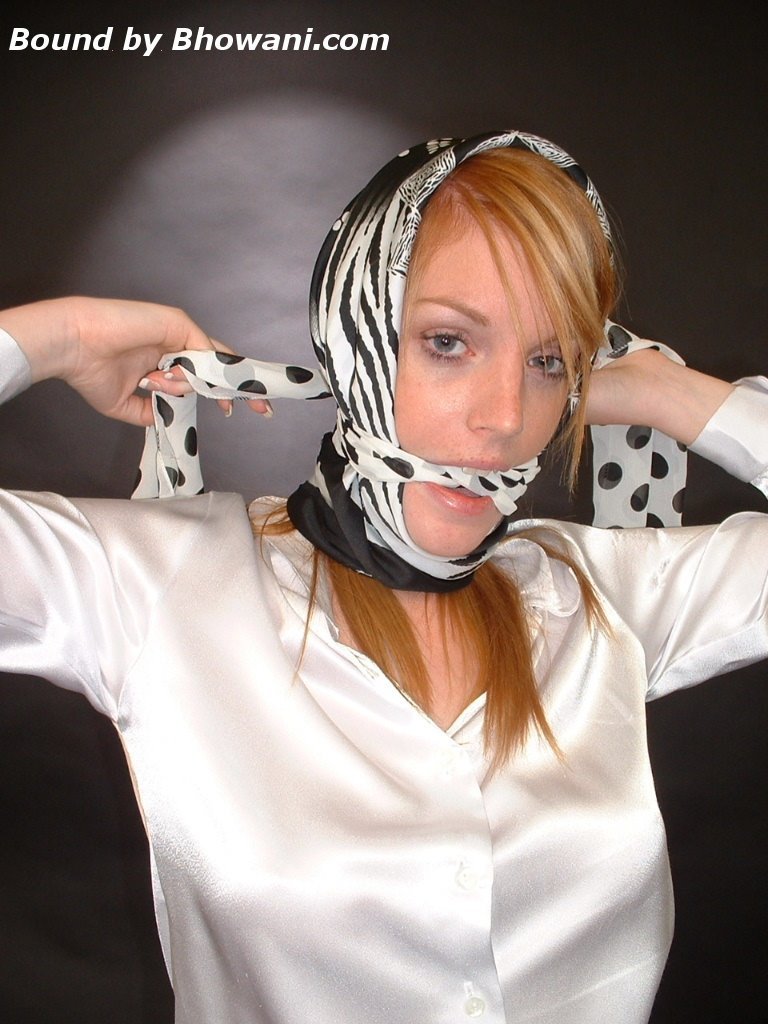graybandanna:  A headscarfed Fi Stevens gags herself with 2 more scarves 