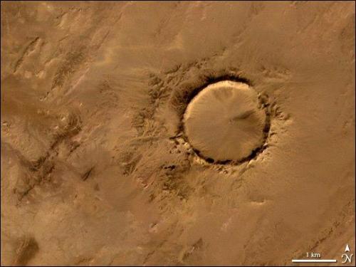 TENOUMER CRATERTenoumer Crater in Mauritania lies within the Sahara Desert; it is a near-perfect cir