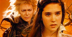 claudiablacks:  get to know me meme - [2/25] films  ↳ labyrinth (1986) dir. jim henson “I can bear it no longer!  Goblin King, Goblin King! Wherever you may be, take this child of mine far away from me!” 