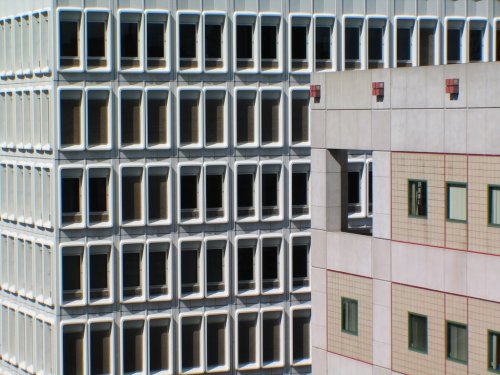 architectureofdoom:  Hall Building (Ross, Fish, Duschenes & Barrett, 1960s) and  J.W. McConnell Library (Sankey Werleman Guy, 1982-92) of Concordia University, Montreal, Canada. View this on the map 