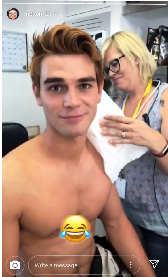 THEY ARE HAIRDRYING SOMETHING ON KJS SHOULDER 