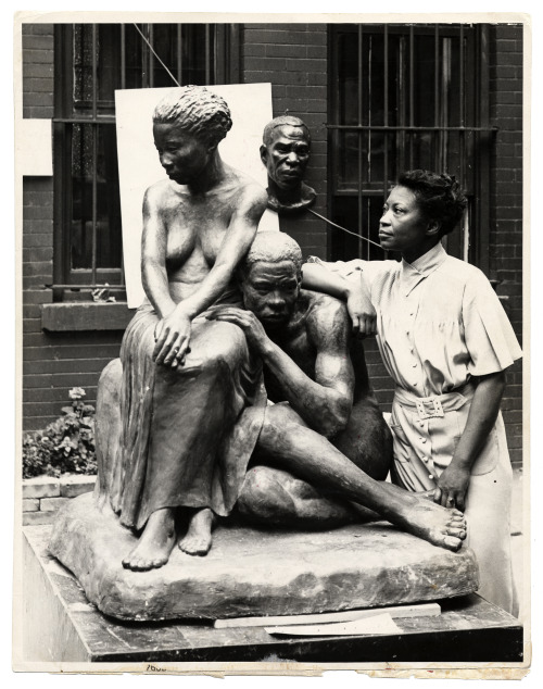 eatingbreadandhoney: Augusta Savage posing with her sculpture Realization, created as part of the Wo