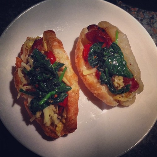 In honor of work being cancelled today due to the cold, I made gourmet croissant sandwiches for breakfast! Ingredients: Croissants eggs, white cheddar, roasted tomatoes, bacon, spinach.