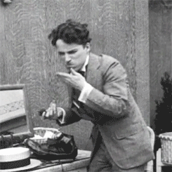 chaplinfortheages:  1919 - Charlie Chaplin shows the Bishop of Birmingham how he