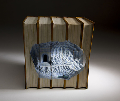 archiemcphee: Today the Department of Beguiling Book Art is catching up with the latest topographical book sculptures created by Montreal-based artist Guy Laramée (previously featured here). Laramée’s ability to carve detailed ice caves, mountains,