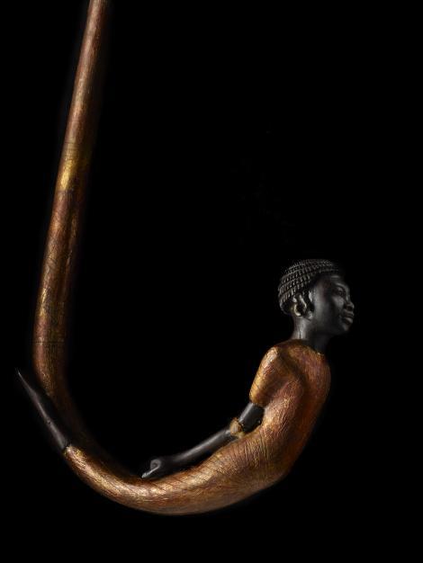 mideastcuts:A carving of a Nubian captive adorns the handle of a walking stick recovered from the to