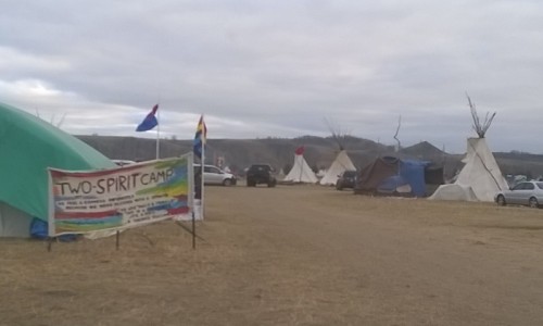 First photo says “Muslims standing with the Standing Rock Sioux. NODAPL”.Second photo is of the Two Spirit Camp. They have gay pride flags and what I think might be a bisexual pride flag but I may be mistaken. It was absolutely incredible to me