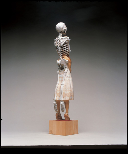 sixpenceee:  The bizarre art of Yoshitoshi Kanemaki. He chisels these life-sized figurative sculptures out of giant pieces of camphor wood, a kind of evergreen. The strange pieces frequently involve two or more characters merged into a single form, which