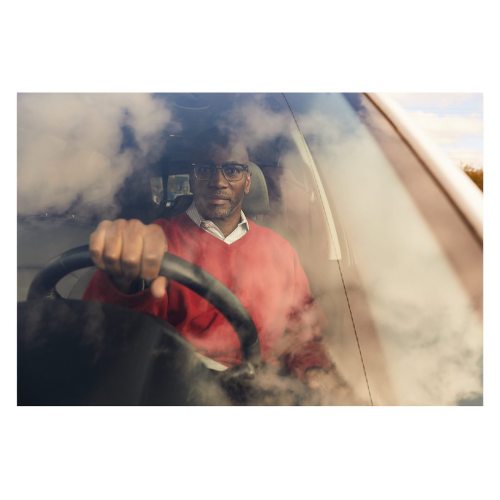 Dr Charles Moore, founder of HEALing community healthcare center, photographed in his car for Harvar