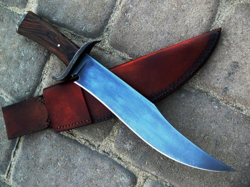 gunsknivesgear:  Neotribal Frontier Bowie from Dervish Knives. 10” blade of 5160 steel.  A lot of wonderful details on this knife are not apparent on first glance, like the sweet curve of the choil and the engraved brass quillons.  A fierce fighting