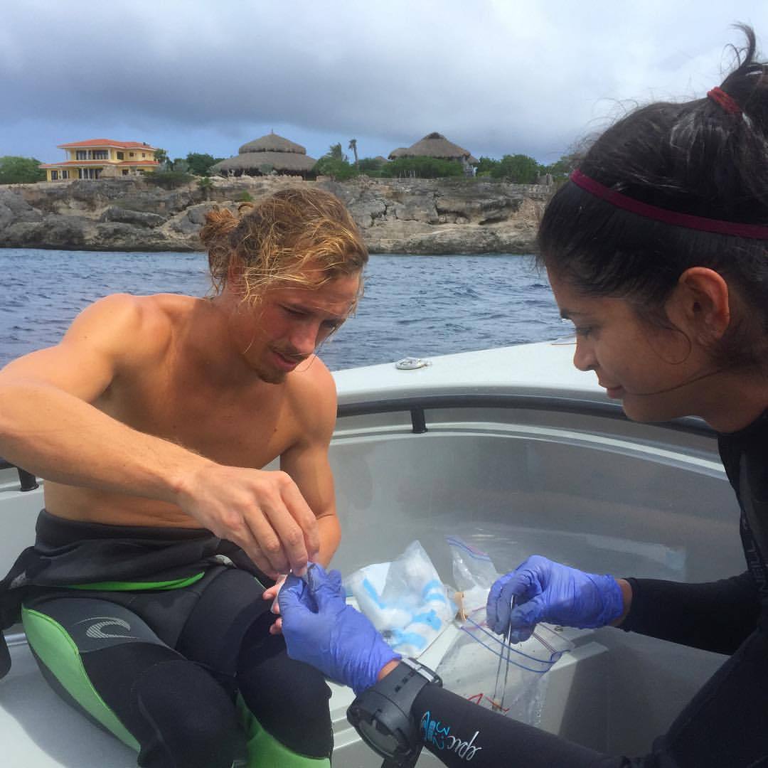 Dedicated to microbes. Two #scientists on our team collect coral and water samples every dive to be analyzed and help tell the story of the #reefs around #Curaçao. #BlueHalo #CuracaoExpedition2015 #marinescience #scienceonthewater