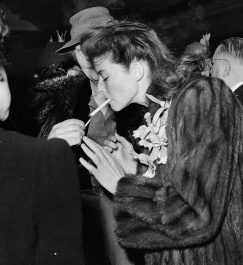 katharinehepburn - Katharine Hepburn getting a light on her...