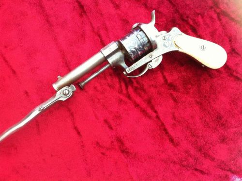 Engraved and inlaid pinfire revolver with ivory grips and folding bayonet, originates from Liege, Be