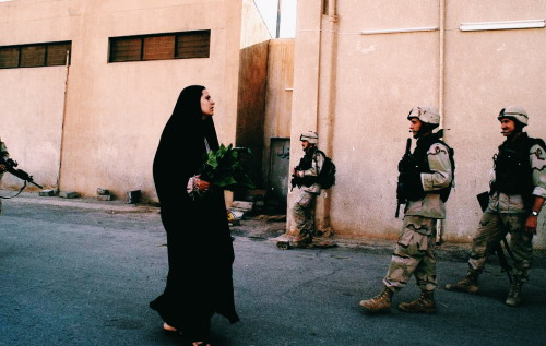 aliirq:  US troops on patrol in the streets in Baghdad, Iraq. July 2003. by Thomas Dworzak 