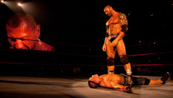 fishbulbsuplex:  Batista vs. John Cena  Batista standing over his fallen victim John Cena!